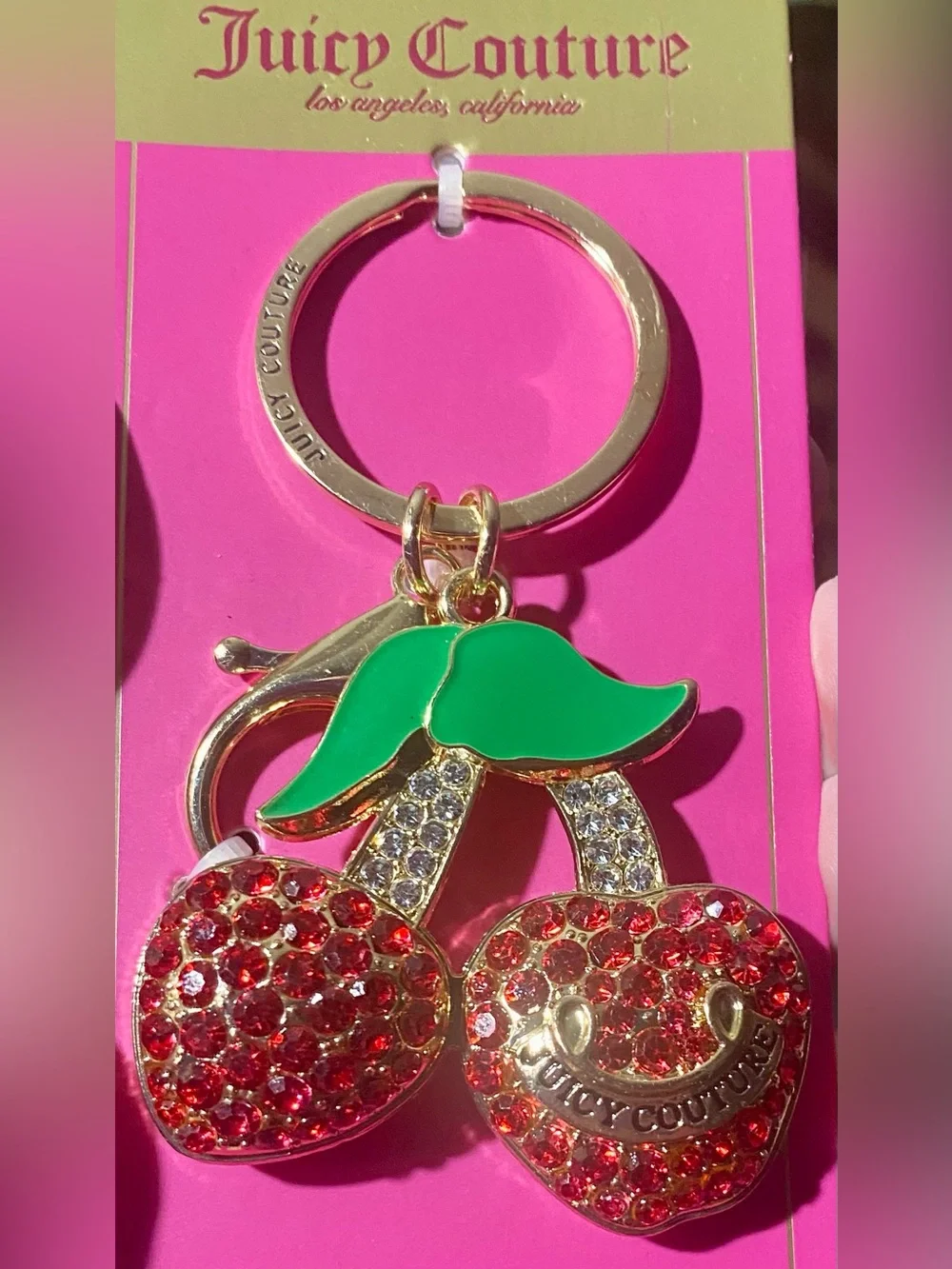 Juicy Couture cherry keychain features red crystal rhinestones and green enamel